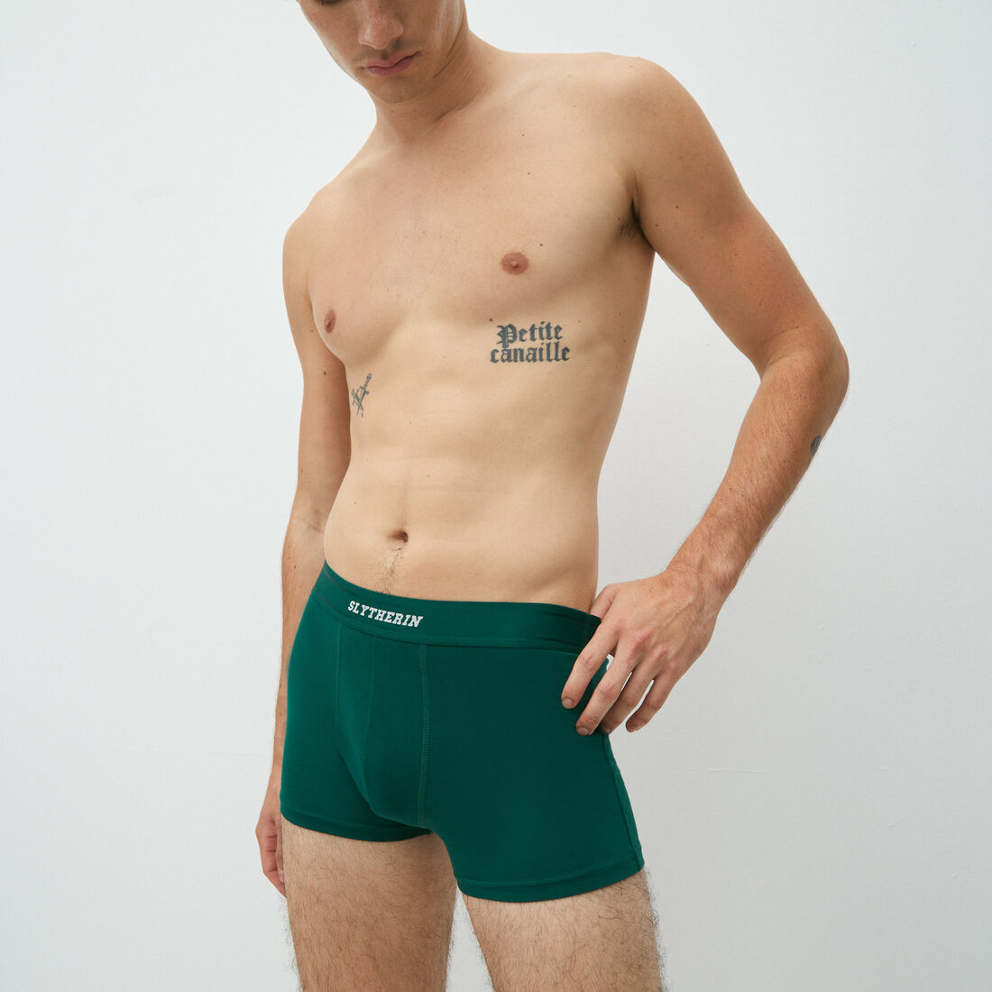 boxer shorts with slytherin lettering;