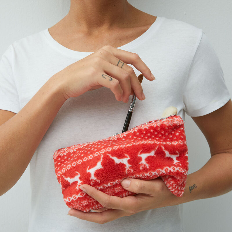 clutch with christmas prints;