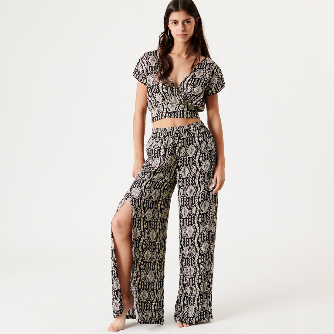 relaxed fit trousers with snakeskin pattern;