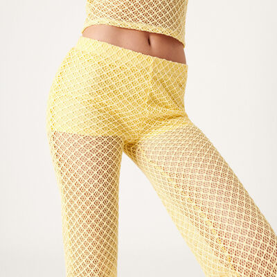 szydełkowe rozkloszowane spodnie — kolor bladożółty;