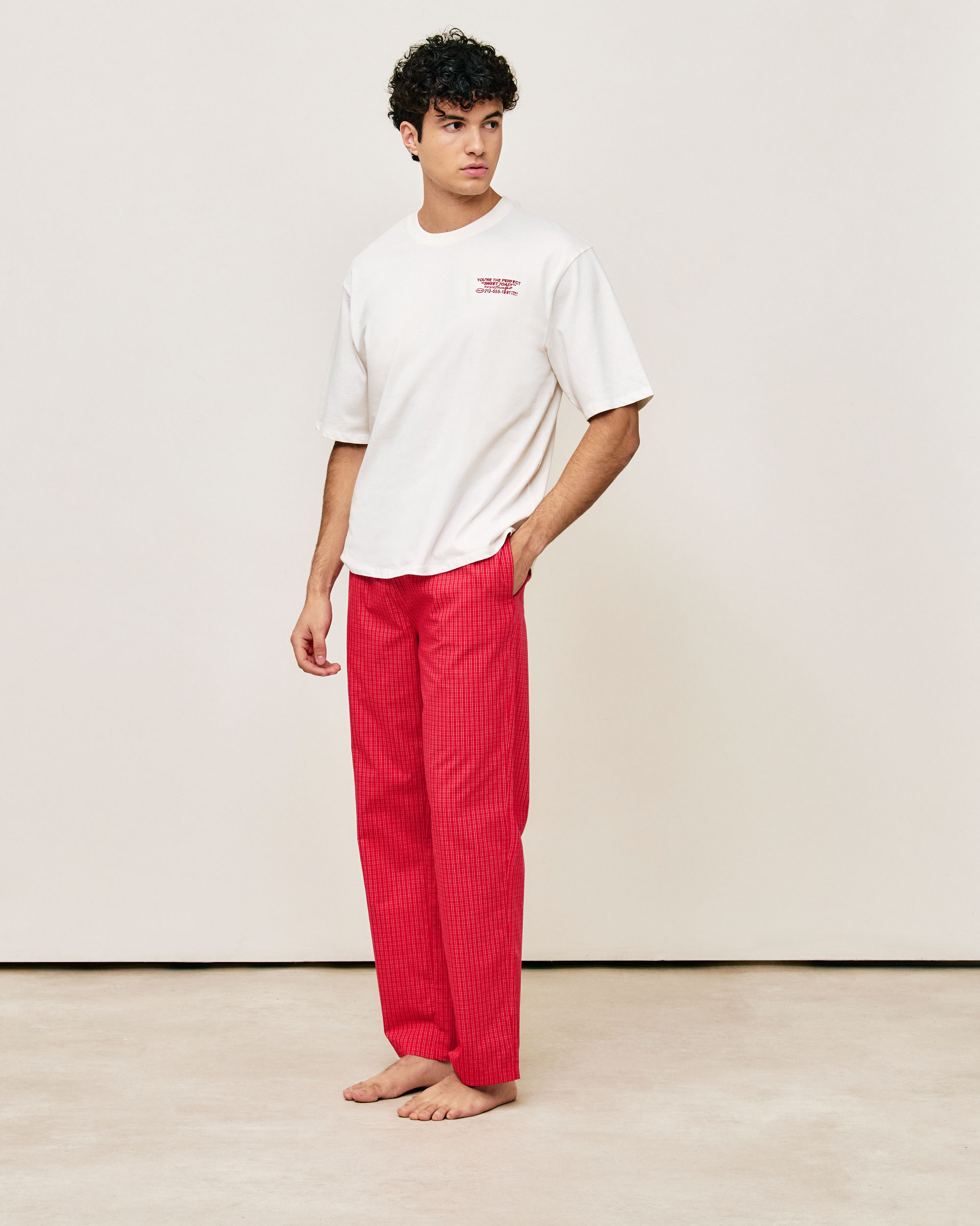 Oversized cotton T-shirt with embroidered motifs and messages
